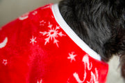 Dog Pajamas in Red, showing close up of neckline with white hem, snowflake design, funny dog pjs for Christmas