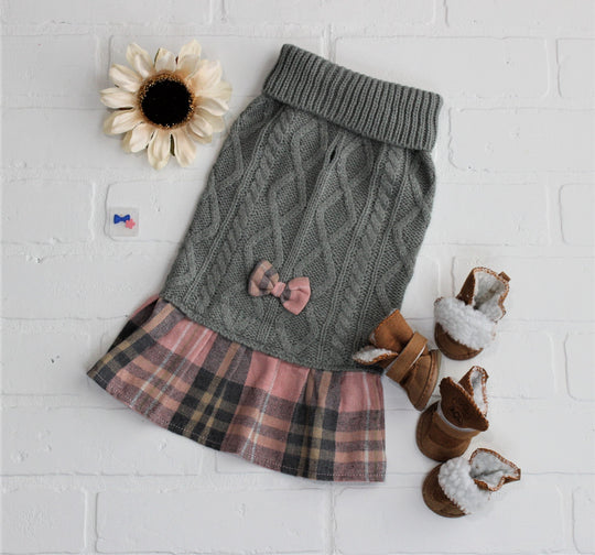 Dog dress for fall with green and pink, flat lay to show plaid bow on back.