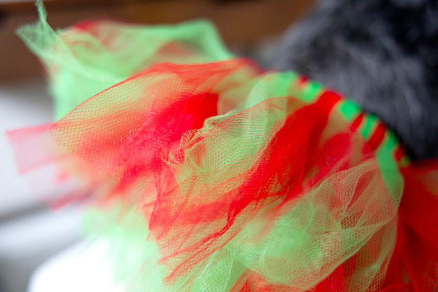 red green dog tutu for party, close up showing alternating colors of red green