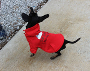 Side view of funny holiday dog sweatshirt in red color.  Design is black and white in color