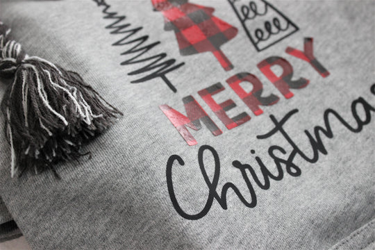 Close up of gray dog sweatshirt showing vinyl Chritmasdesign.