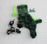 good dinosaur dog costume in green, soft fleece, flat lay with dog accessories