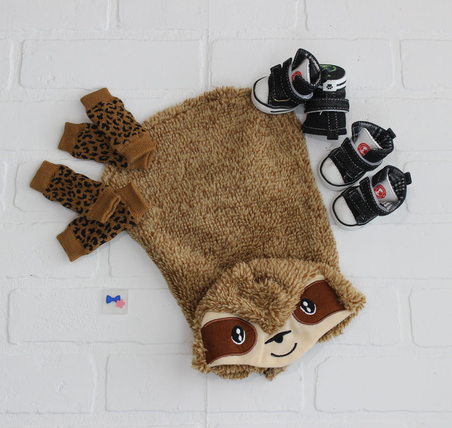 flat lay of sloth cat costume, dog costume, with pet accessories